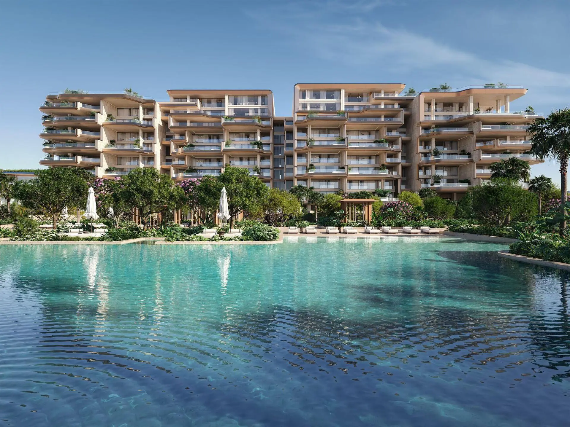 Modern waterfront view of Alba Residences with lush gardens, pool, and elegant terraces.