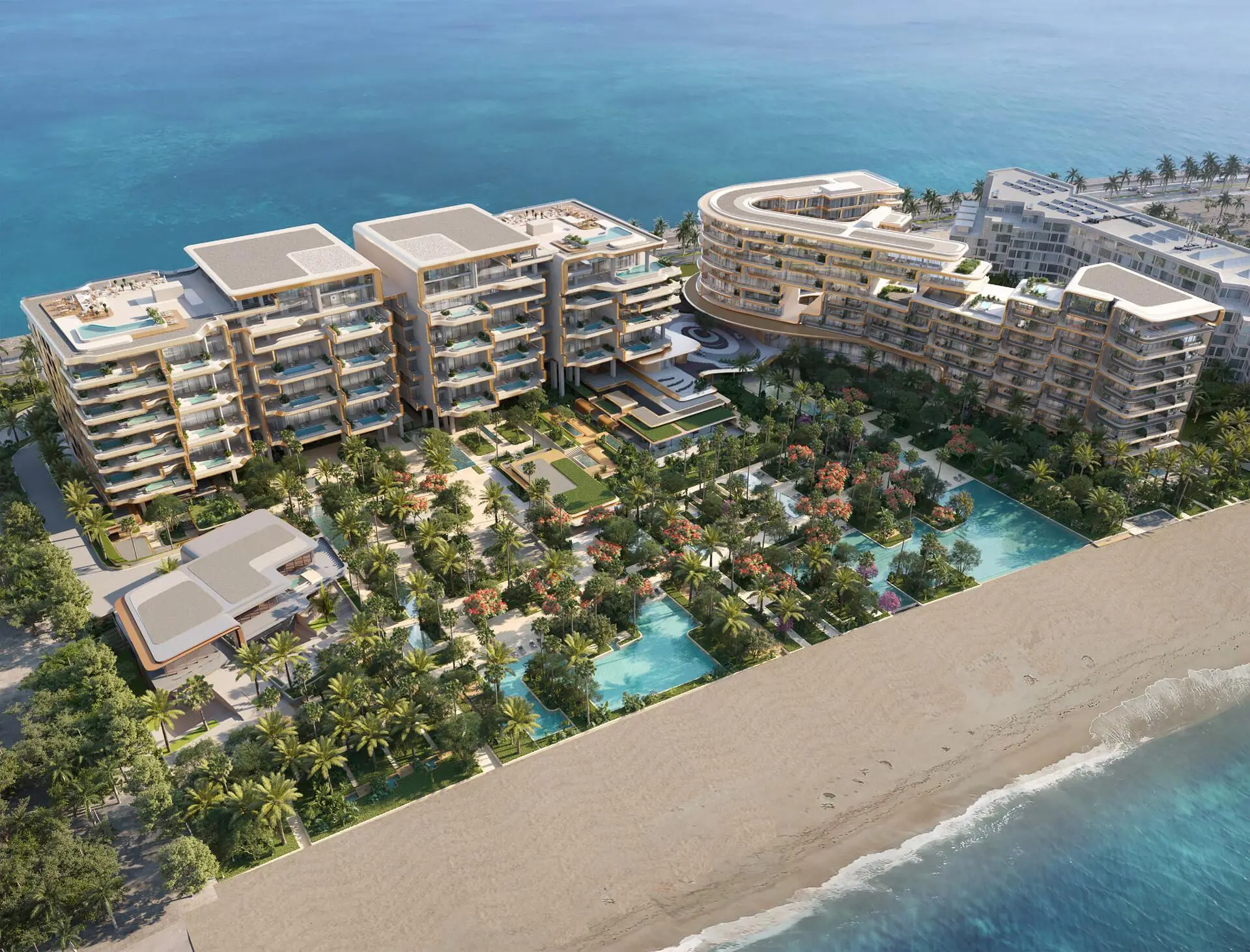 Aerial view of Alba Residences with lush gardens, pools, and beachfront location.