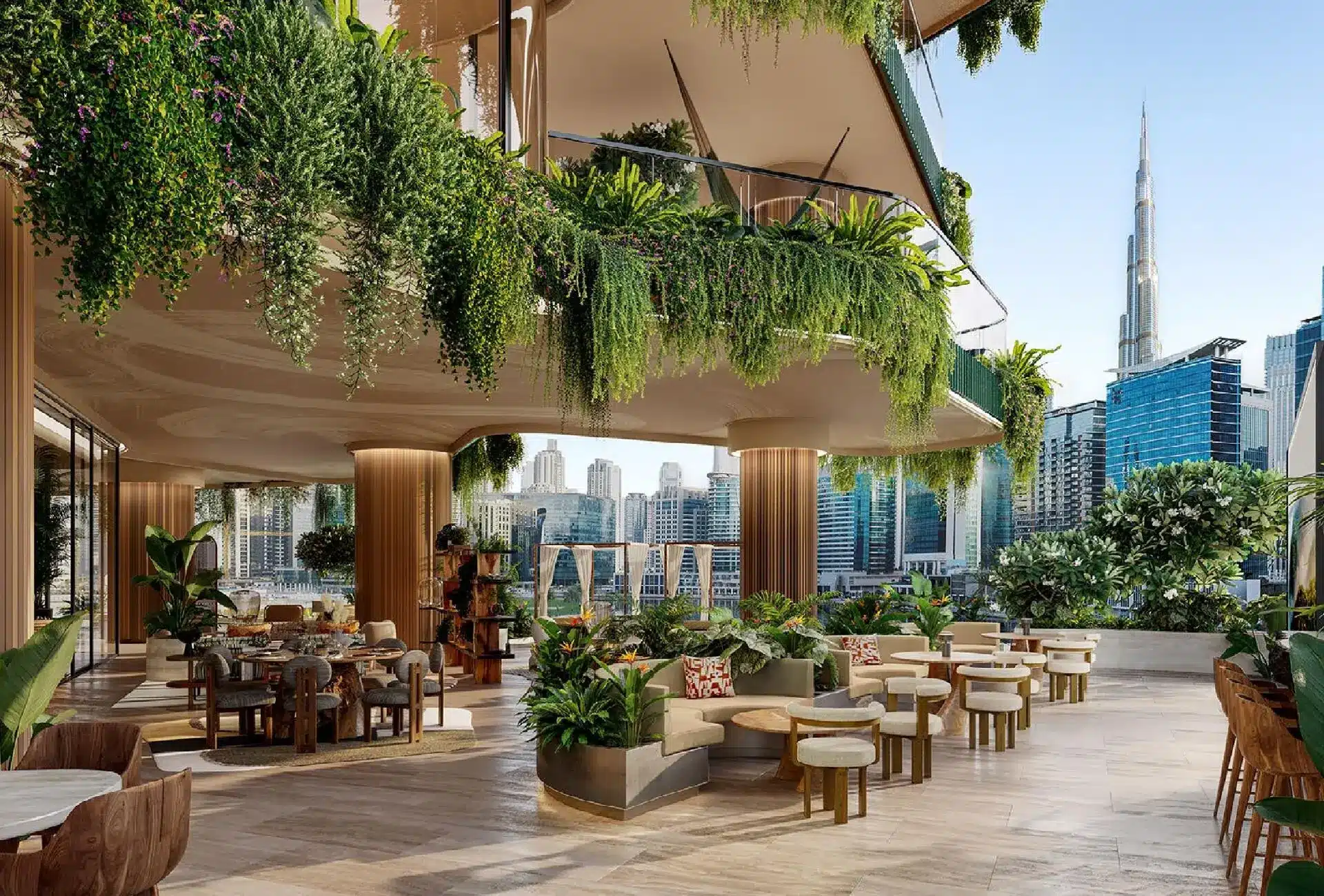Luxurious outdoor lounge at Eywa Dubai with lush greenery and Burj Khalifa skyline views.