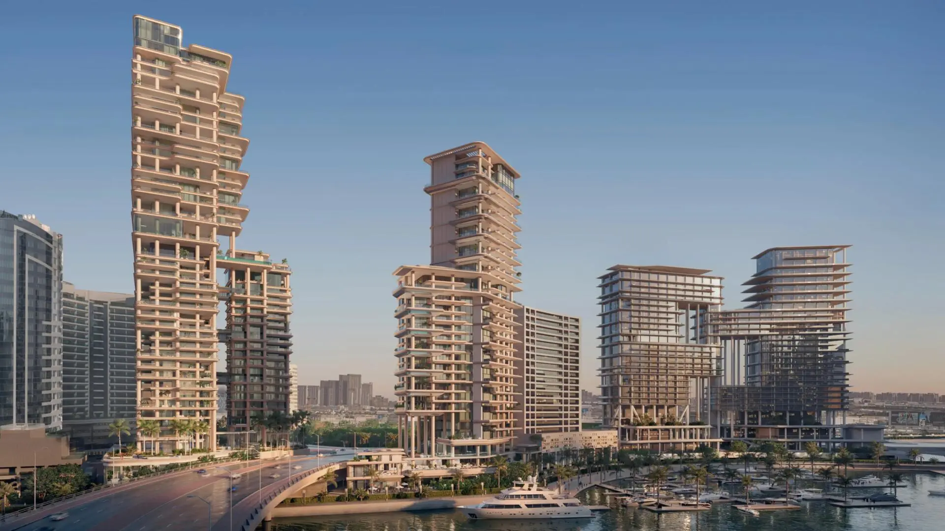 Modern waterfront towers of Vela Viento rise beside a marina with yachts and palm-lined promenade.