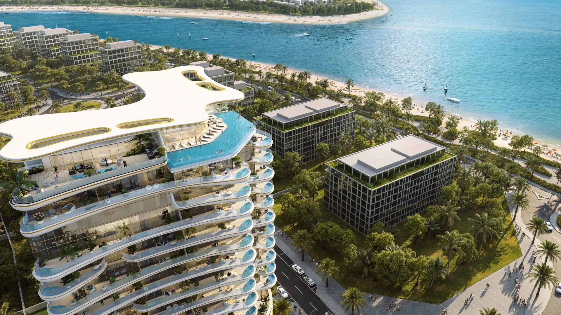 Aerial view of Beach Walk Grand 2 featuring a rooftop pool, beachfront, and lush modern towers.