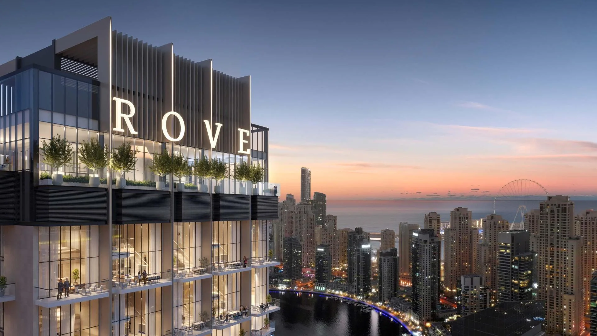 Rove Home tower overlooking Dubai Marina skyline at sunset with modern glass design