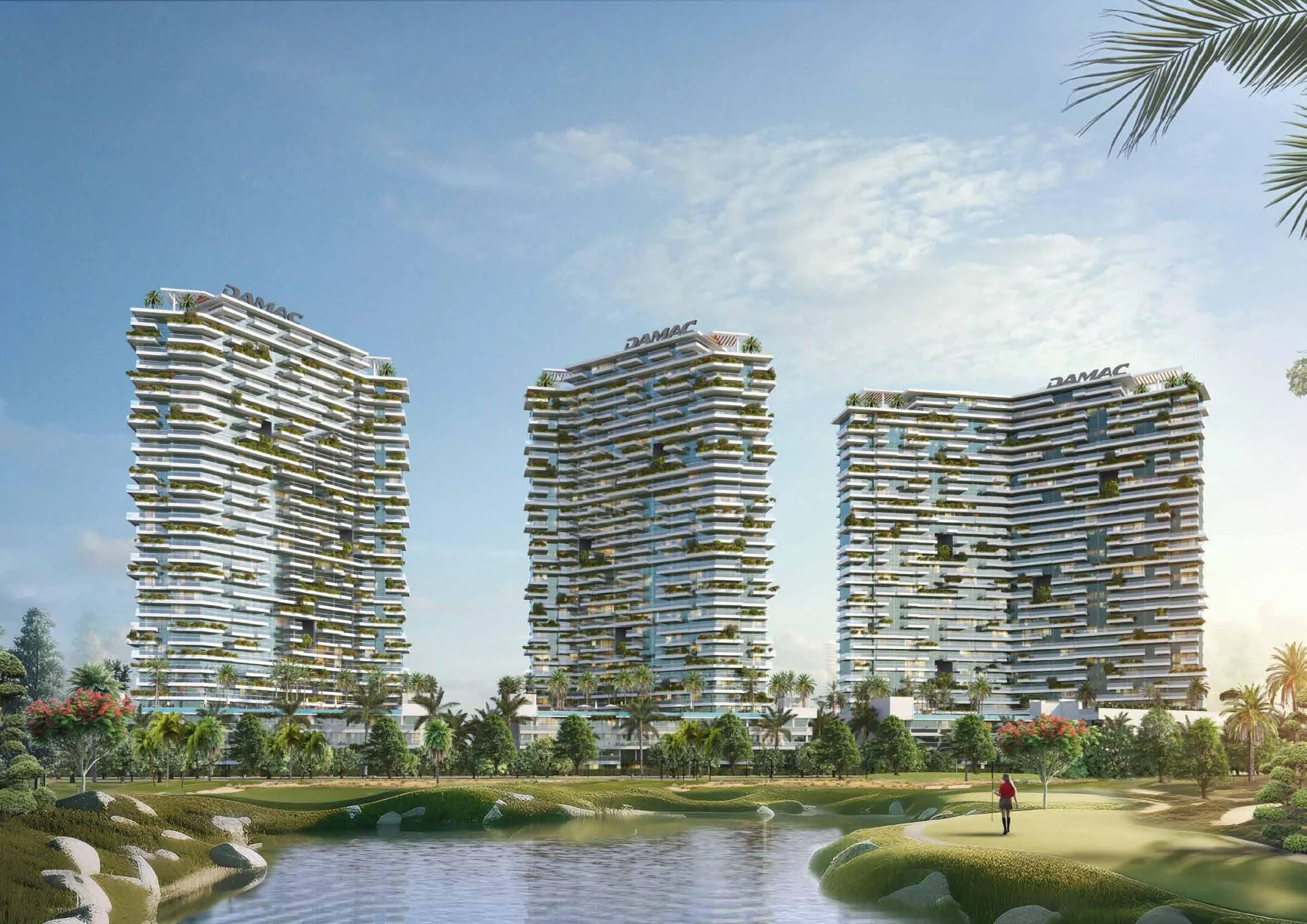 Modern towers of Golf Greens surrounded by lush golf course and water views.
